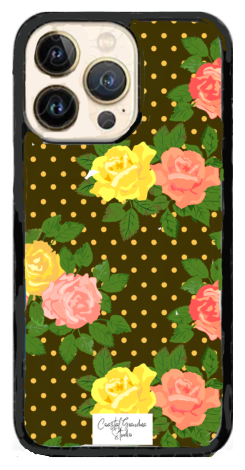 Vintage-inspired cottagecore protective floral phone case. Back background with yellow and pink roses on adark polka dot background.