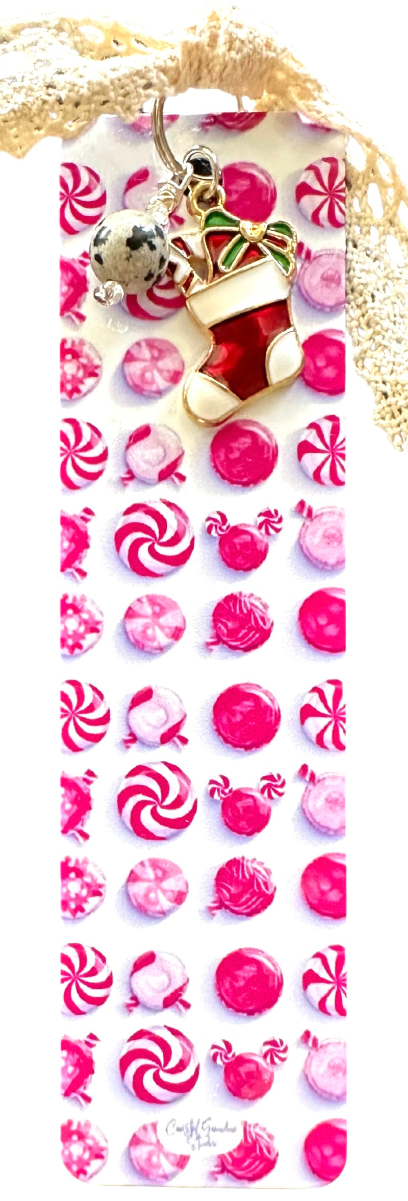 This Christmas stocking charm candy bookmark blends playful detail with vintage-inspired style, making it the perfect companion for your favorite books and/or journals.