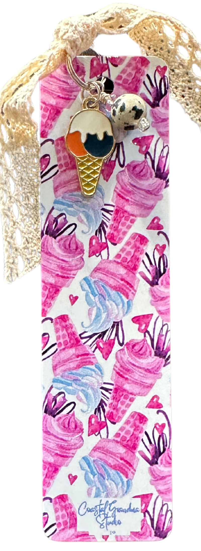 This vintage0inspired ice cream cone bookmark has an enameled charm and a Dalmation Jasper bead. It all comes together with a vintage-inspired lae ribbon. Perfect bit of whimy.