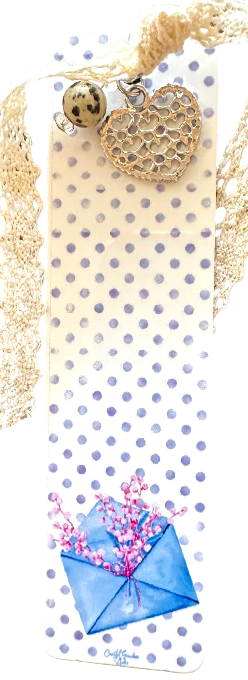 A lightweight aluminum bookmark with a vintage lace ribbon, a filigree heart charm, and a genuine Dalmation Jasper bead 