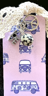 Close up detail of the charms on this flower child hippe er van.