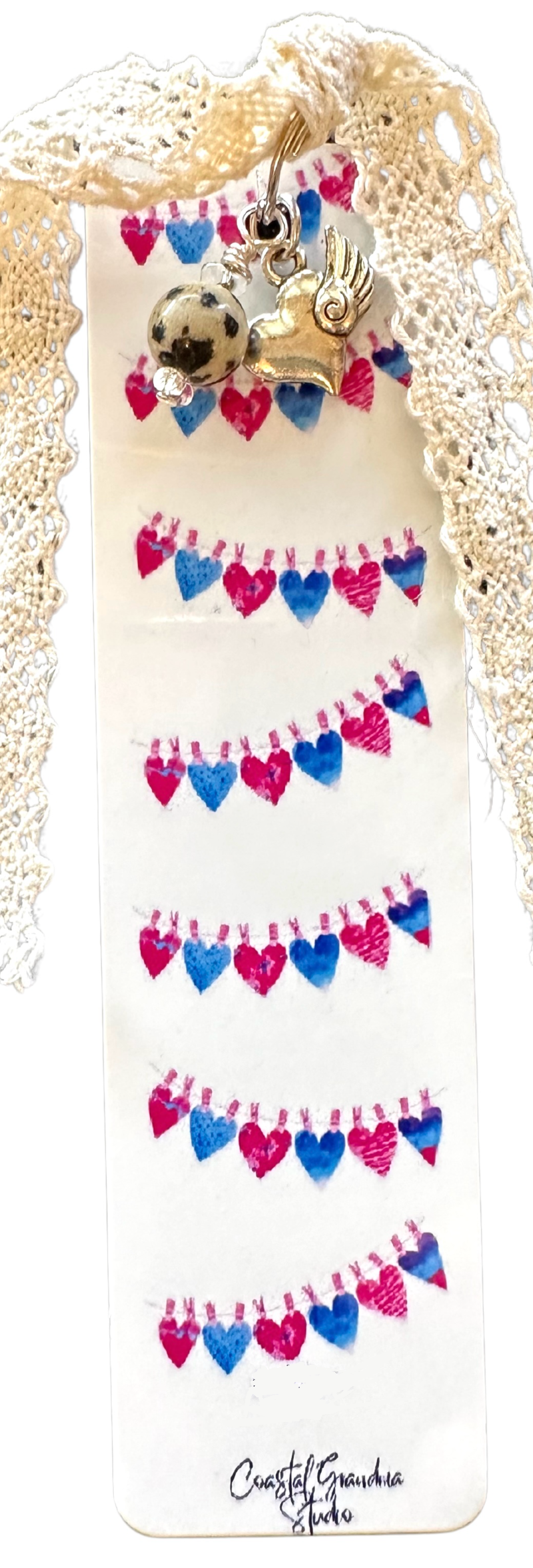 A lightweight aluminum bookmark with vintage lace, winged heart charms and a Jasper bead with a whimsical aesthtic.